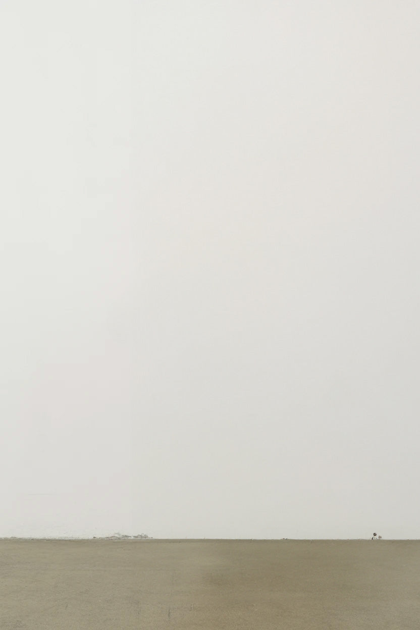 Minimalist empty room with plain white wall and floor