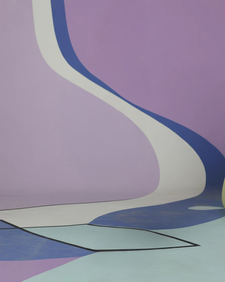 Abstract lavender wall with flowing geometric floor patterns