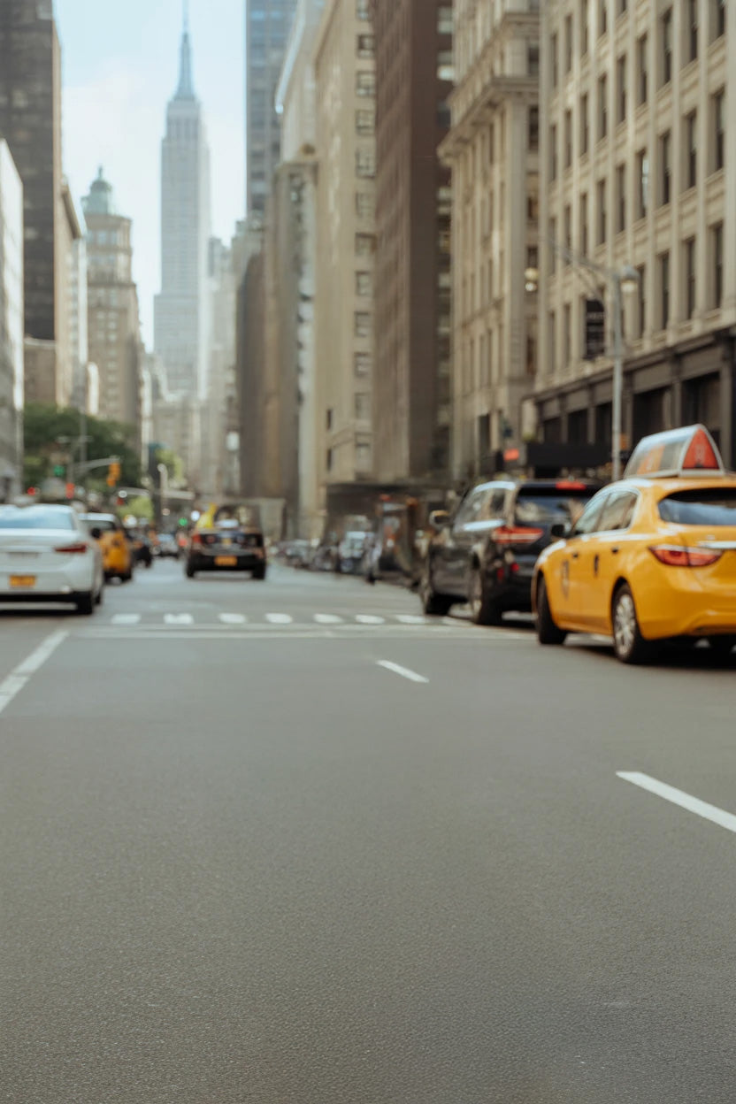 Busy city street with taxis and tall urban buildings