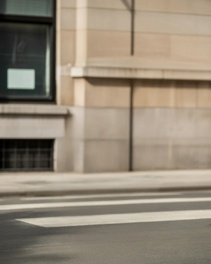 Urban street view with stone building and crosswalk lines