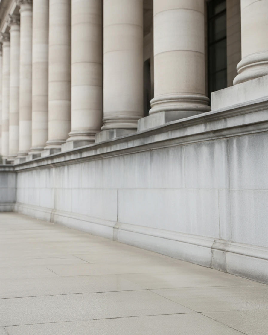 Elegant stone building exterior with tall classical columns