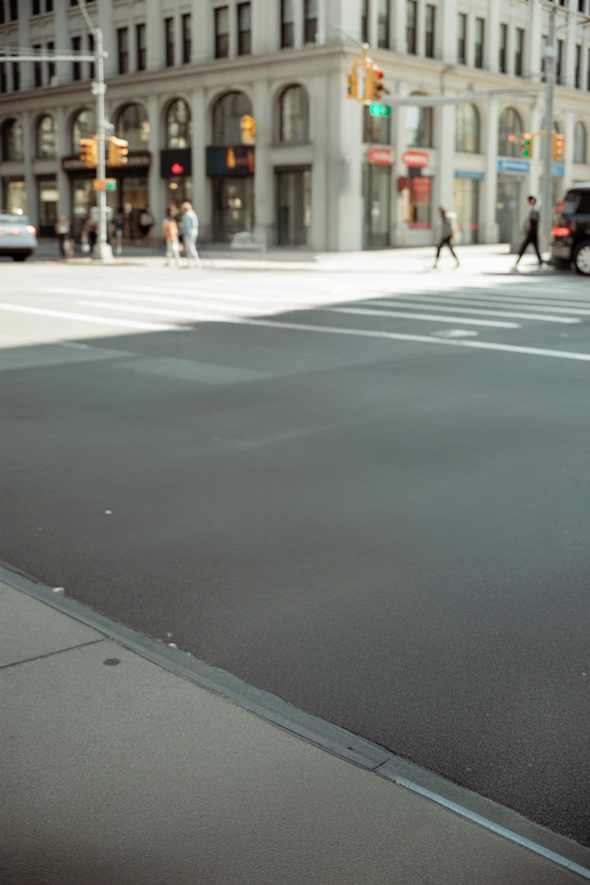 Urban street intersection with historic building and crosswalks