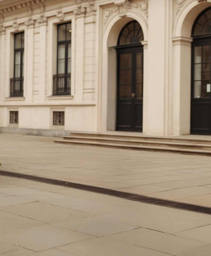 Elegant historic building facade with arched doors and windows