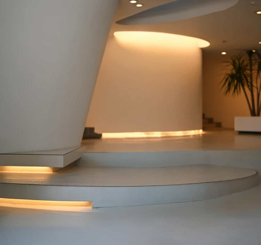 Modern interior with curved walls and warm recessed lighting