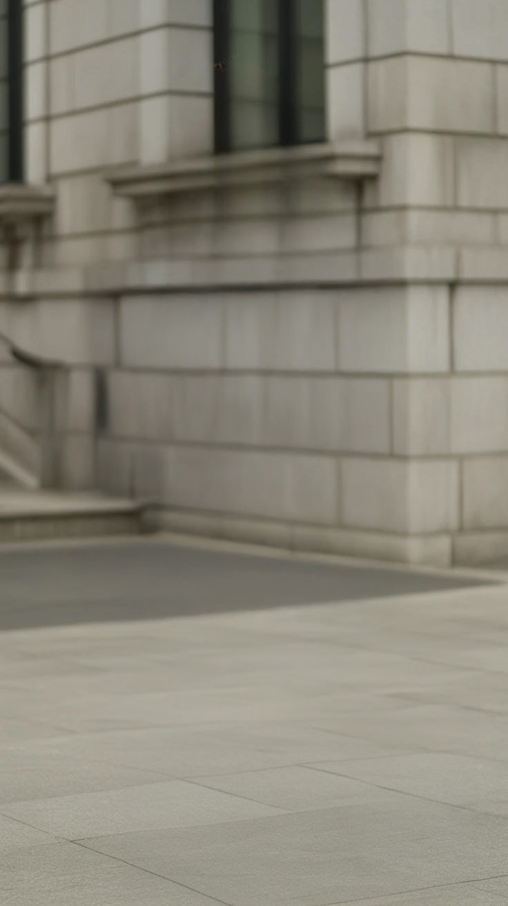 Stone building exterior with tiled pavement and staircase