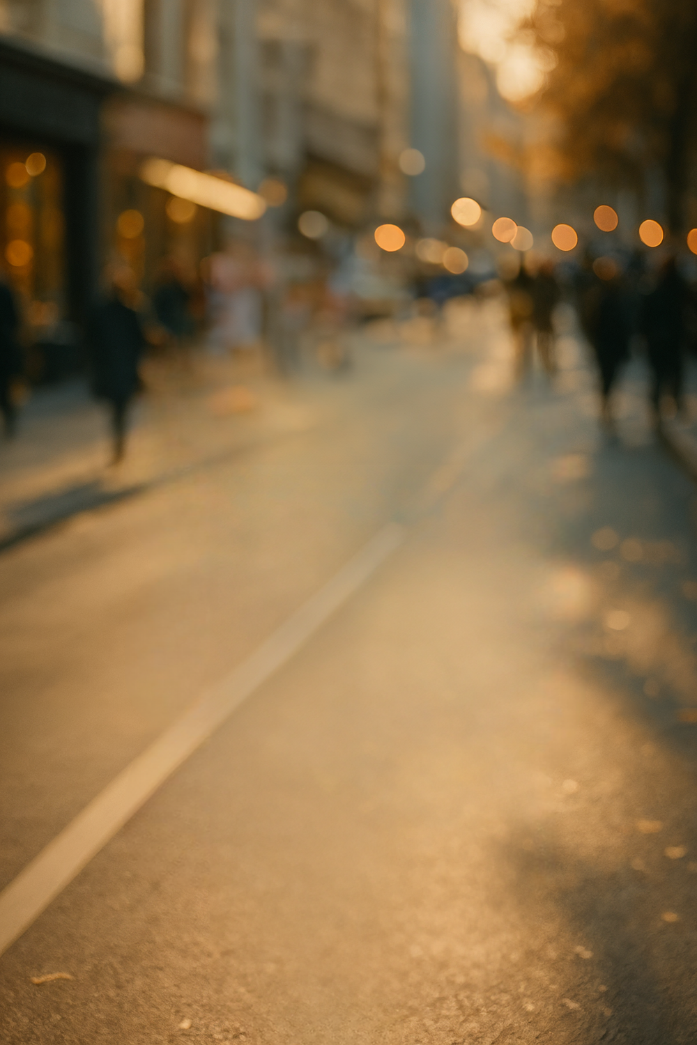 Golden city street glowing under warm sunset light
