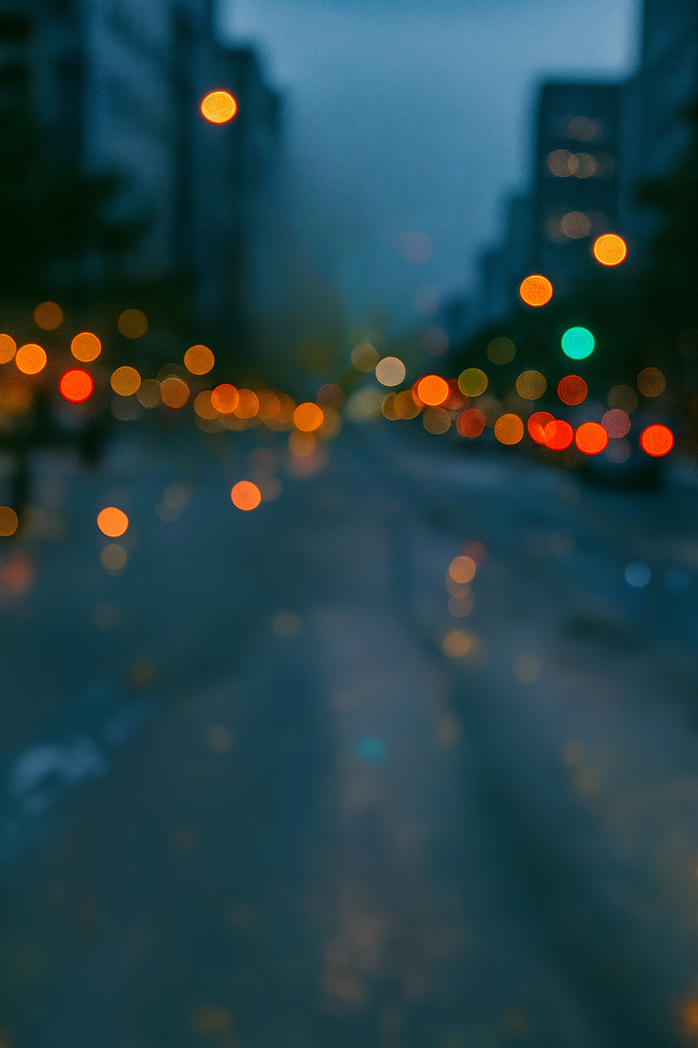 City street at dusk with colorful bokeh lights