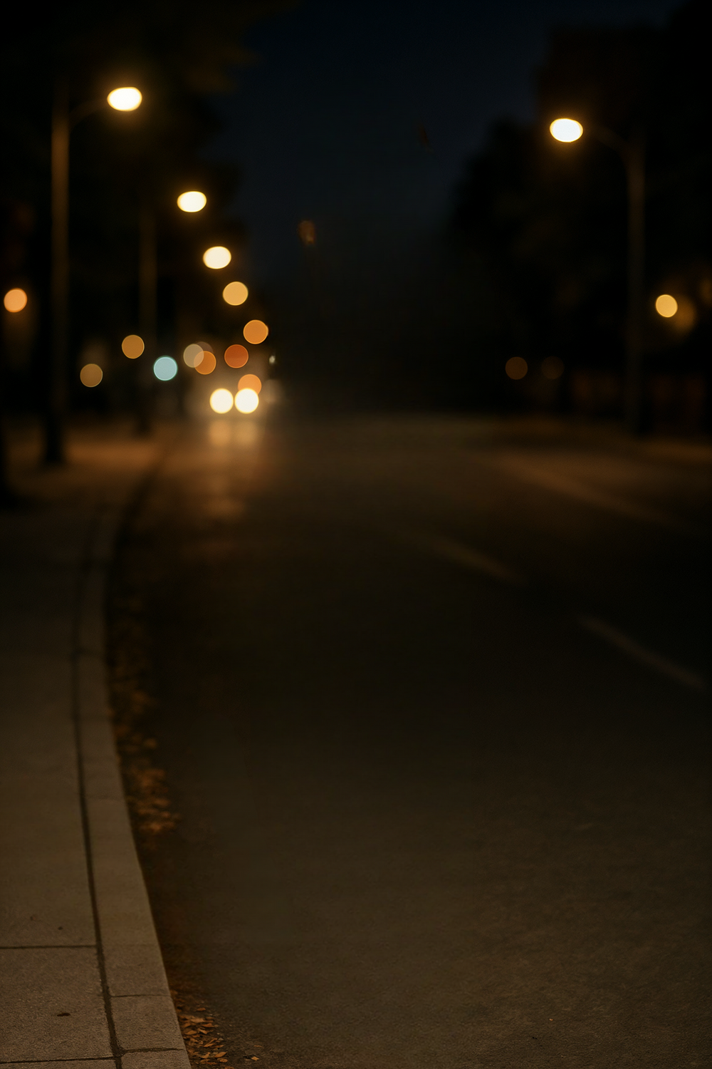 City street illuminated by warm glowing streetlights