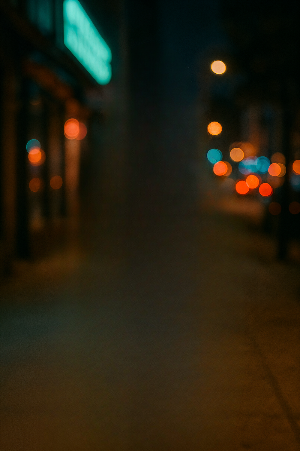 City street at night with bokeh lights glowing