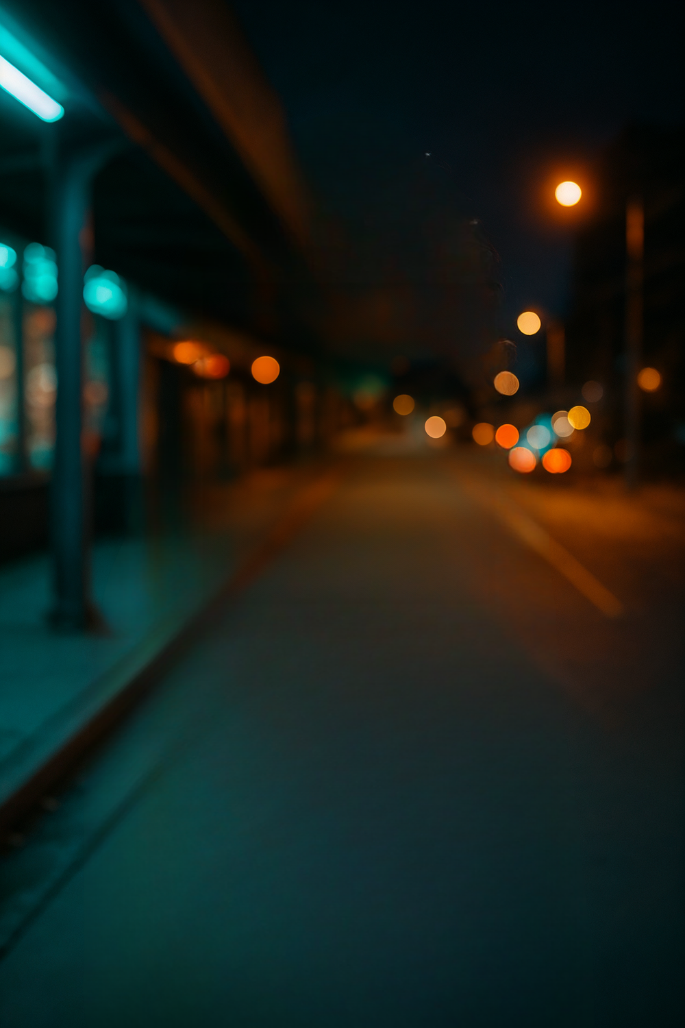 Moody urban street scene with neon and bokeh lights