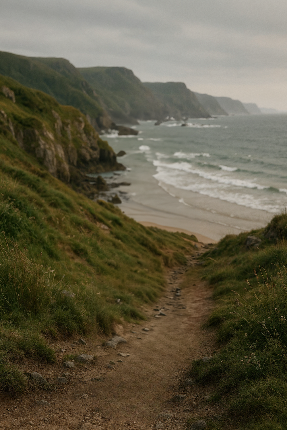 Cliffside coastal path overlooking ocean waves and beach