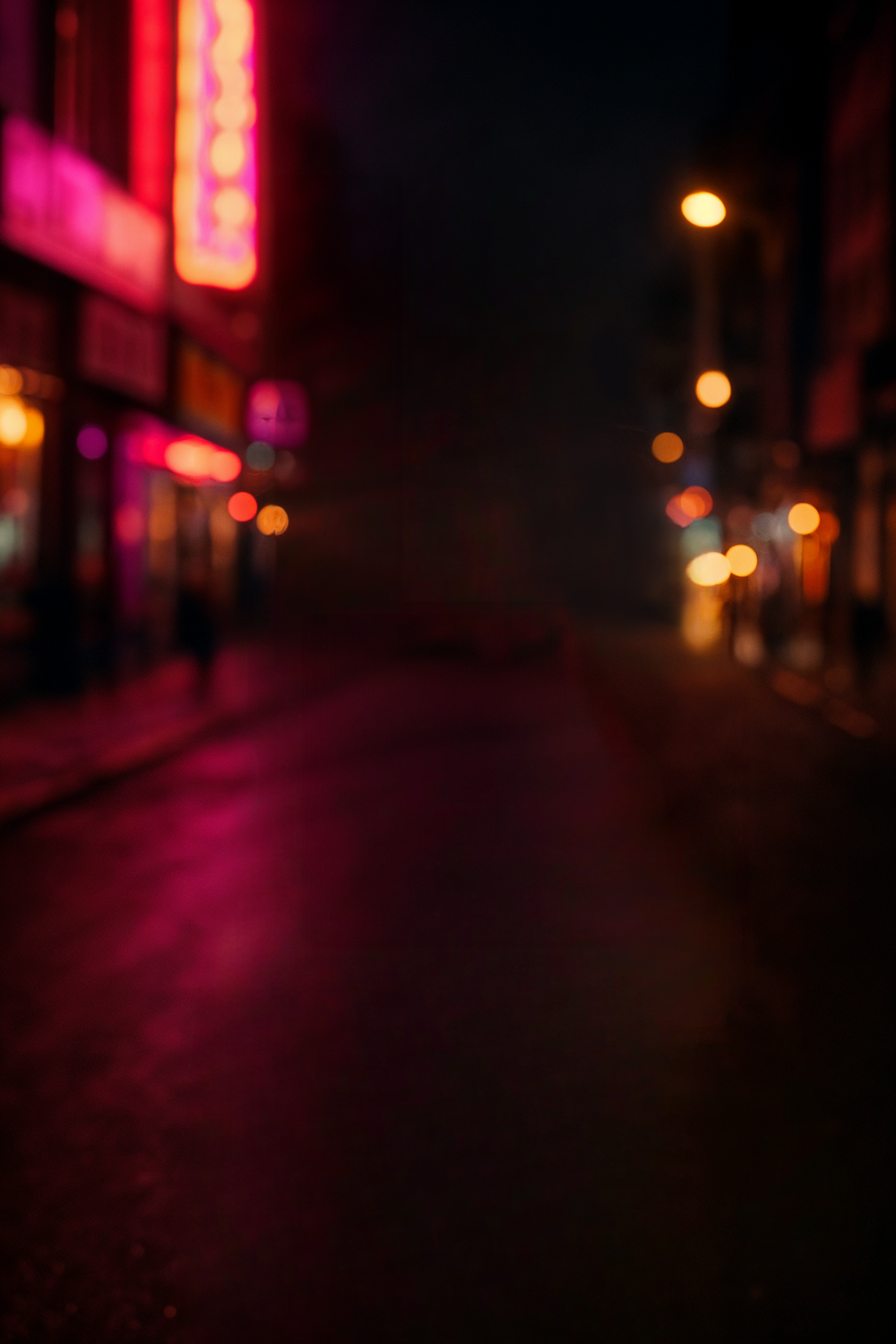 Vibrant city street at night with neon lights