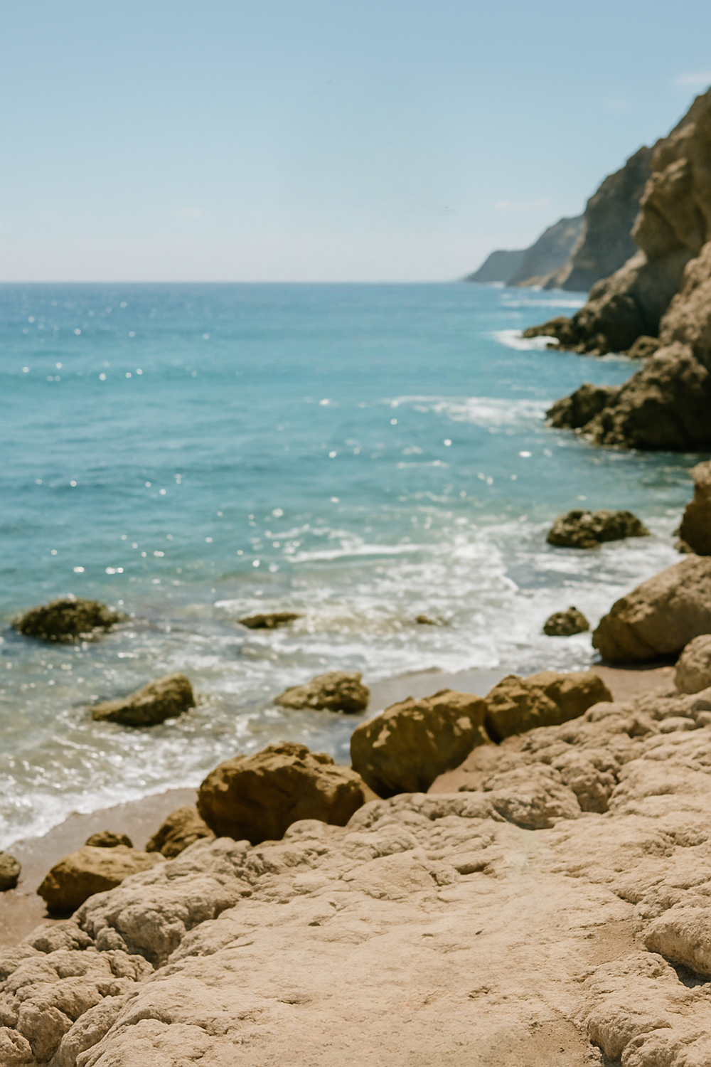 Rocky beach with turquoise water and coastal cliffs
