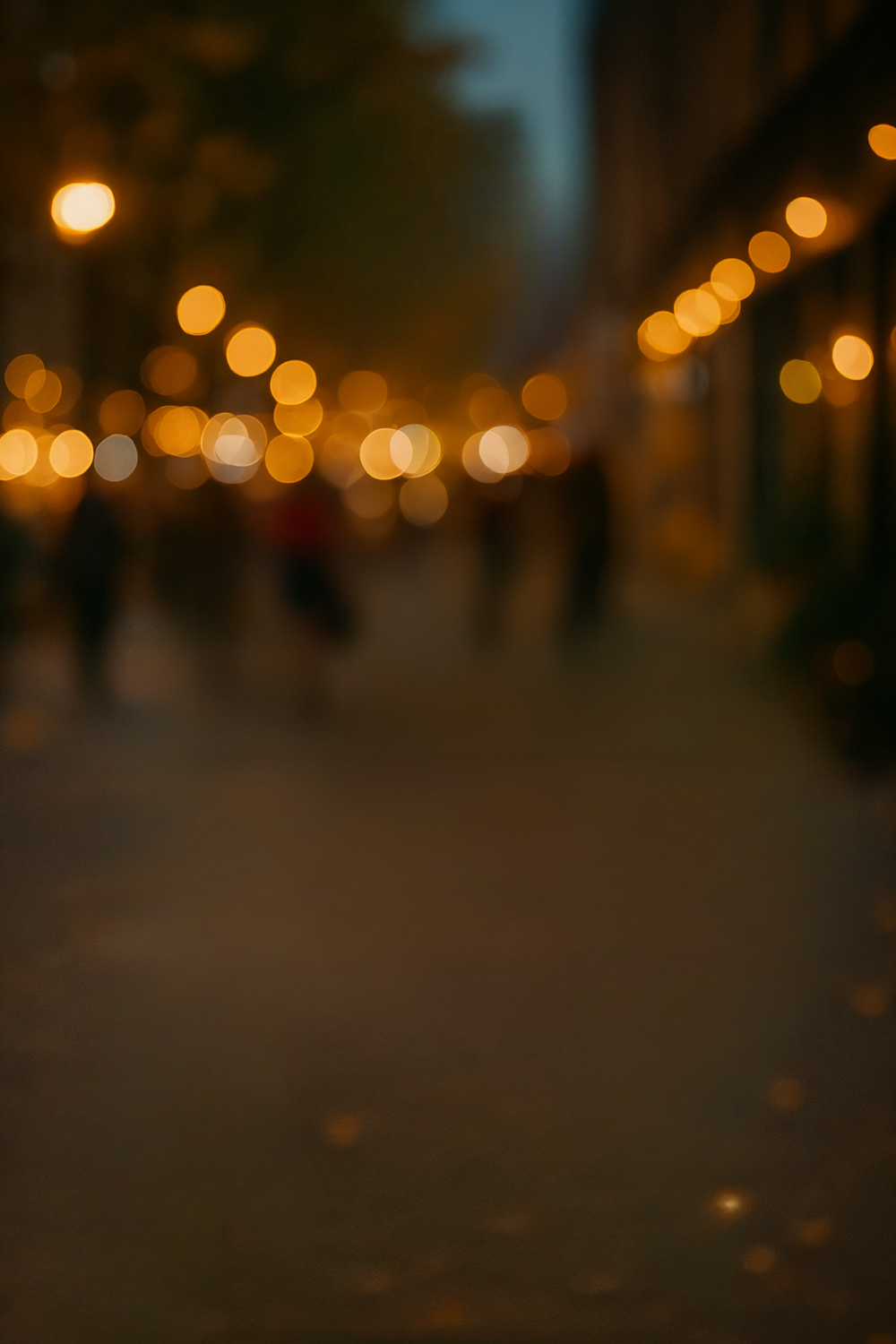 Charming city street lit by warm evening lights