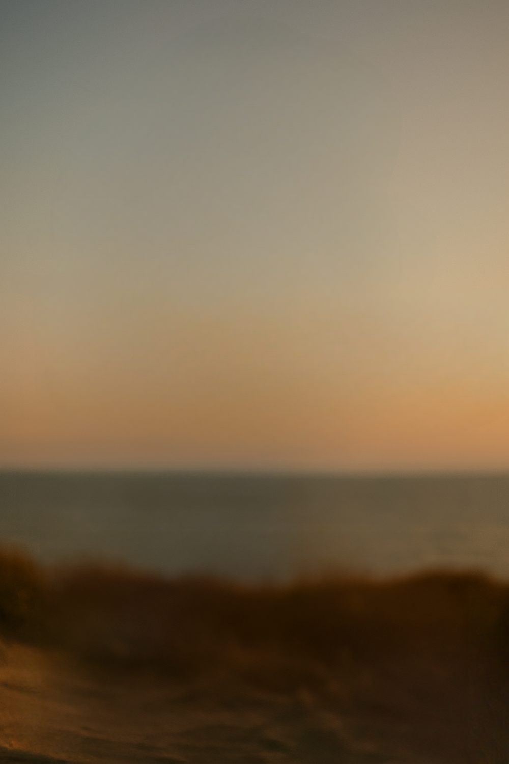 Tranquil beachside view bathed in golden sunset light