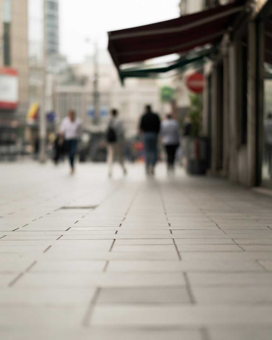 City sidewalk with awnings shopfront, and soft perspective blur