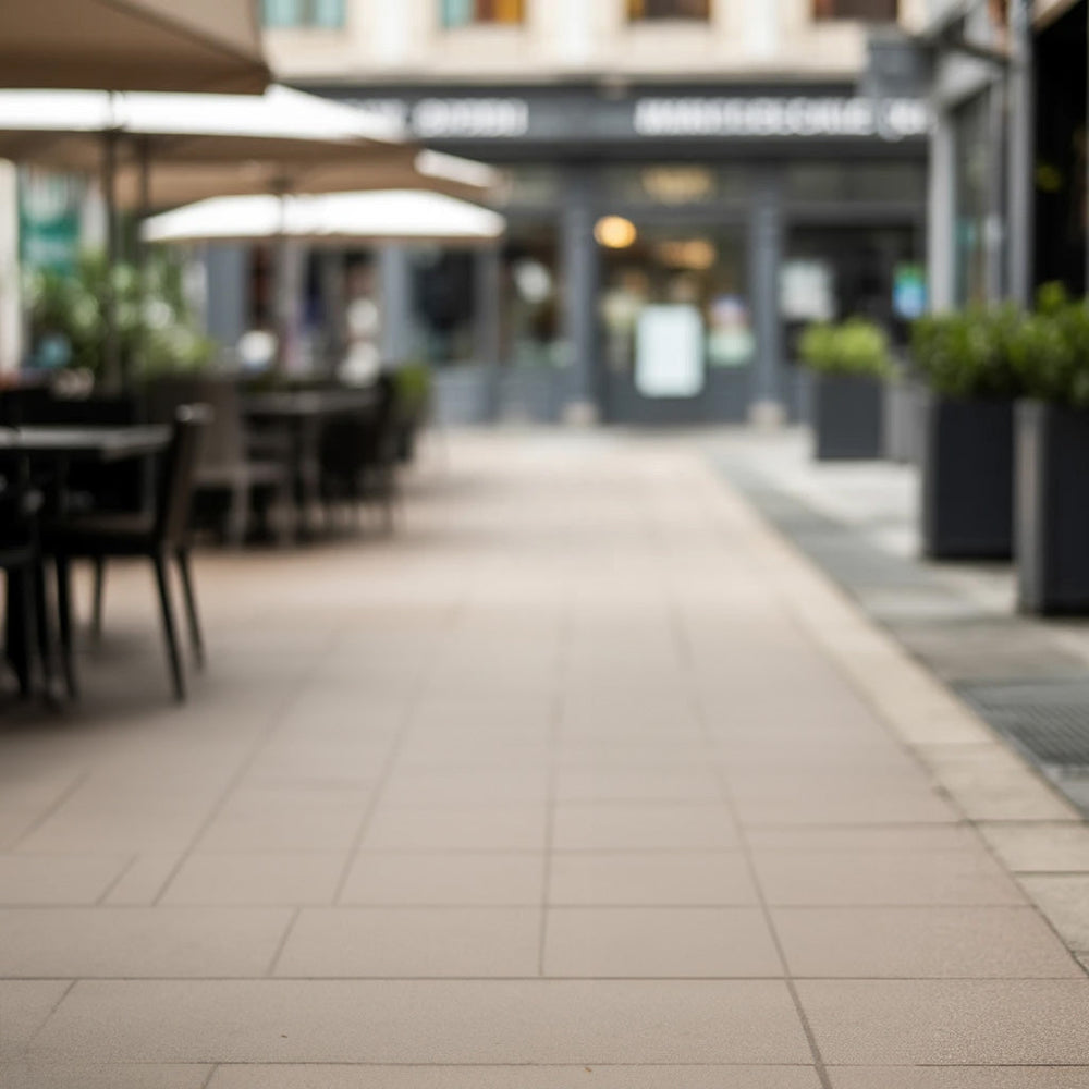 Outdoor café walkway with umbrellas and warm neutral tones