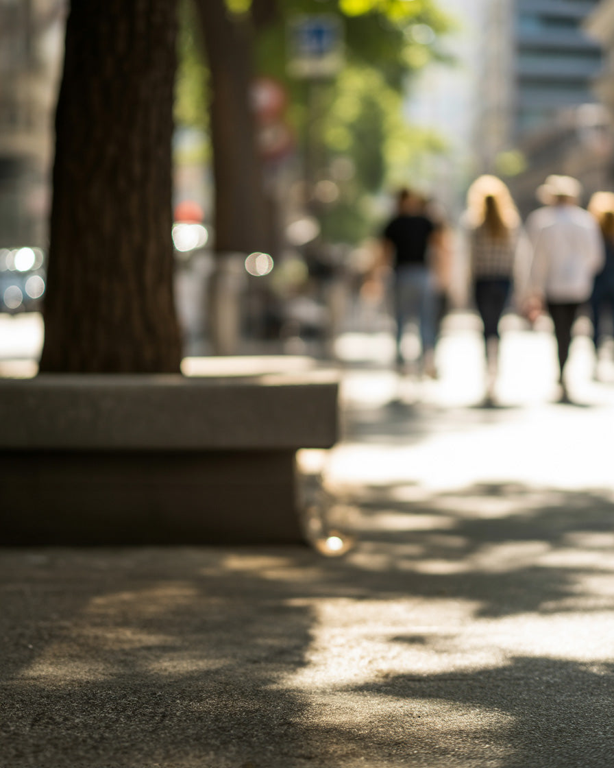 Sunlit city sidewalk with pedestrians in warm afternoon light