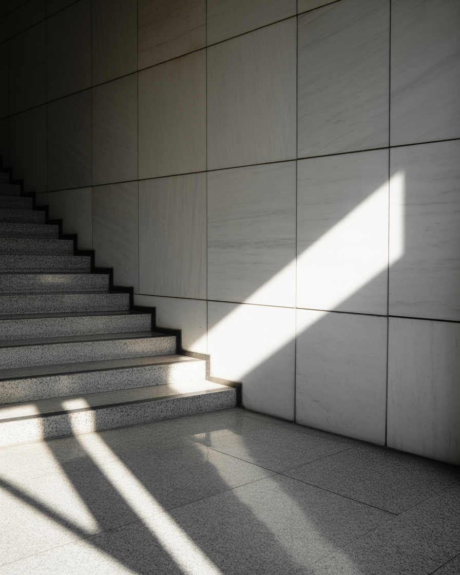 Minimalist staircase with morning light casting shadows