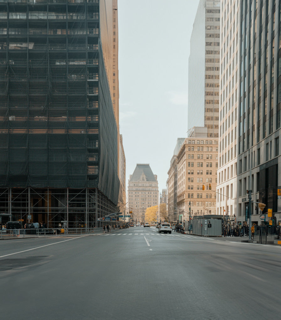 Downtown soft morning light street with tall buildings