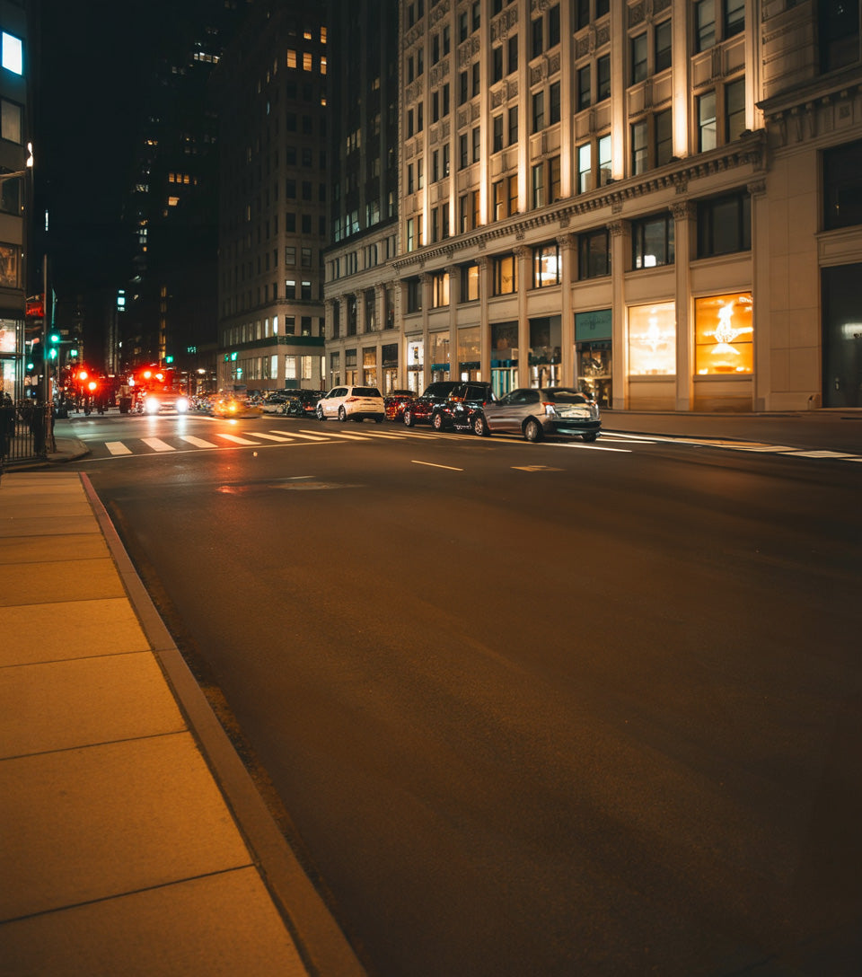 City street glowing with night lights and soft reflections