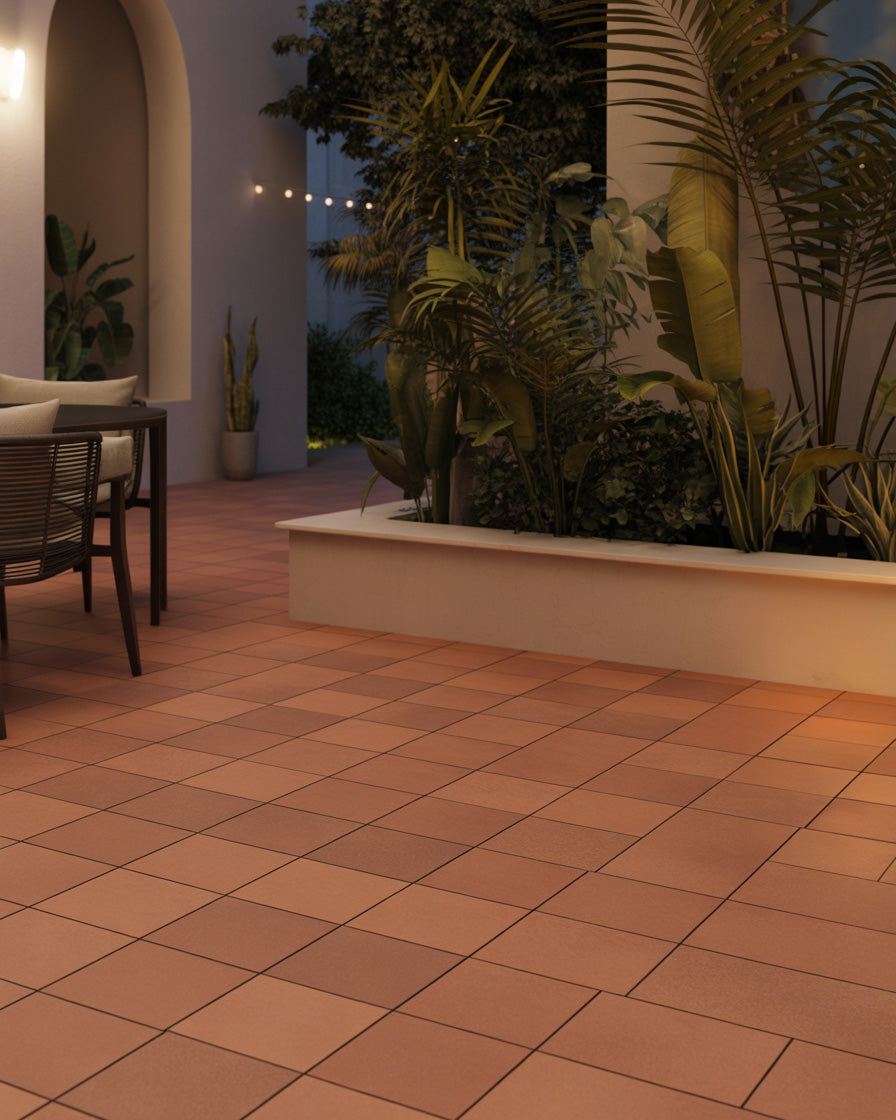 Warm tiled patio with lush tropical plants at dusk