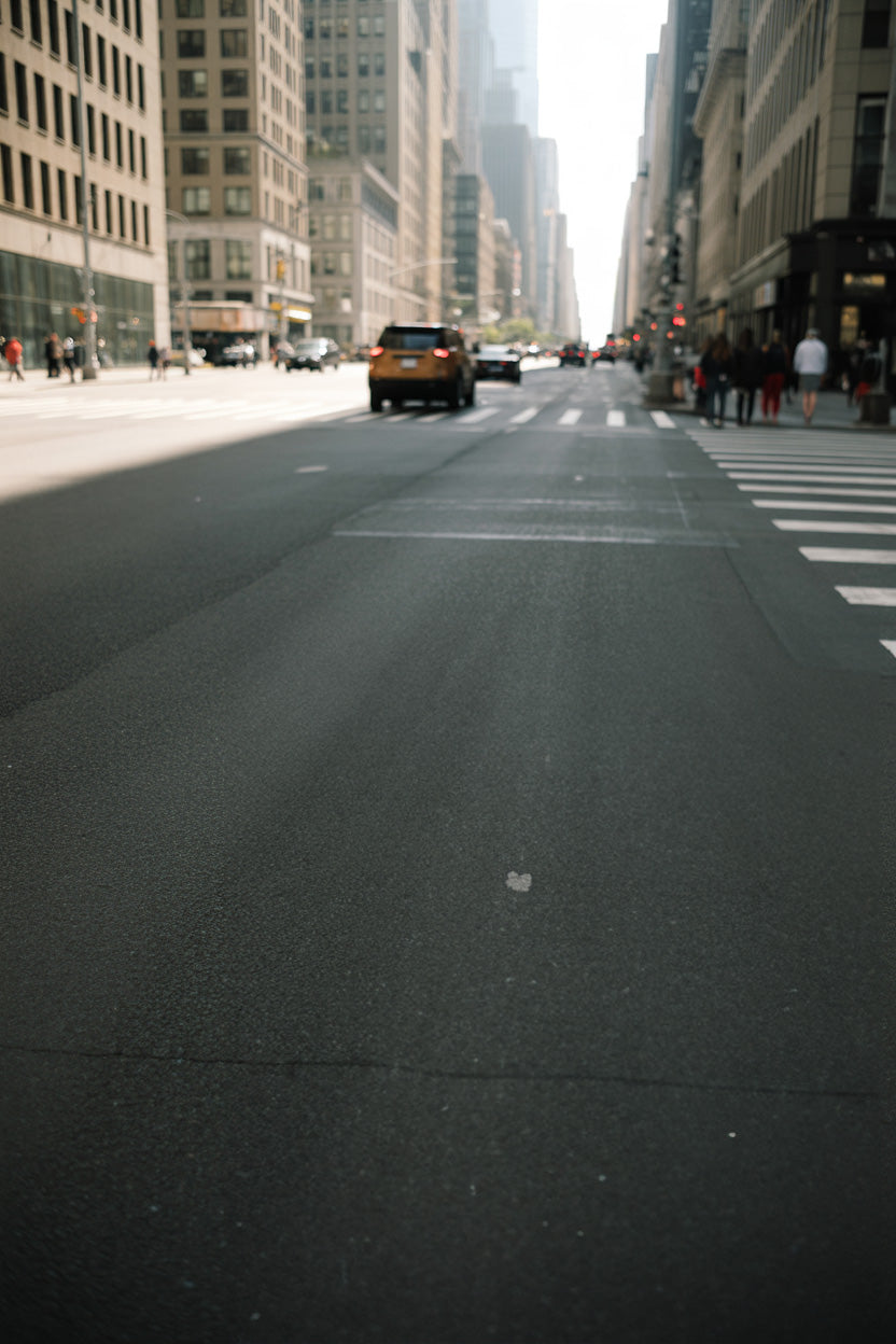 Wide downtown street with crosswalks and soft daylight
