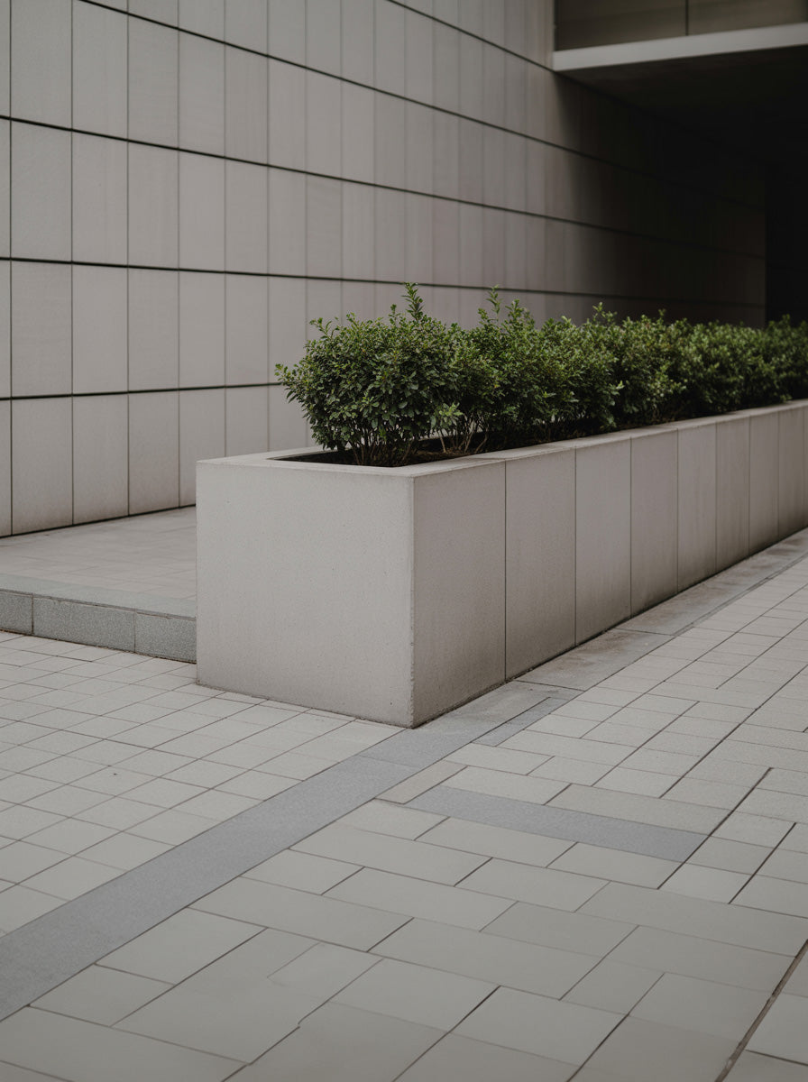 Minimalist concrete planter in modern architectural courtyard