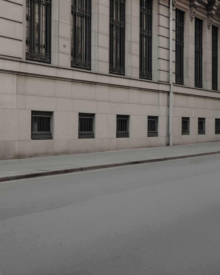 Quiet stone city facade along empty urban street